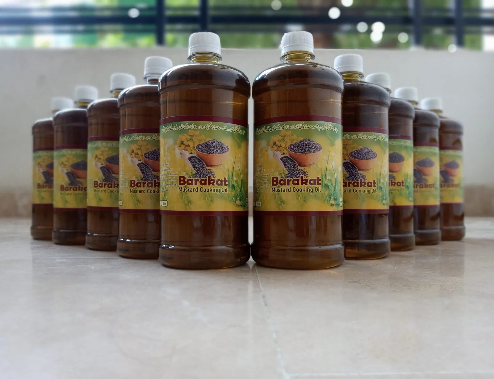 A row of Barakat mustard cooking oil bottles